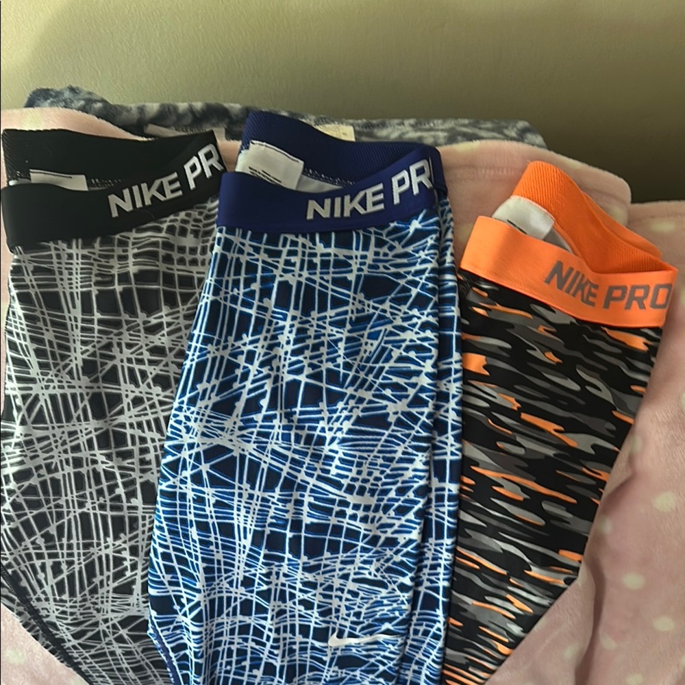 Lot of 3 Nike Pro Women's Athletic Leggings Black, Blue, and Orange. EUC size m